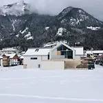 Modern Alpine Penthouse With Lake View